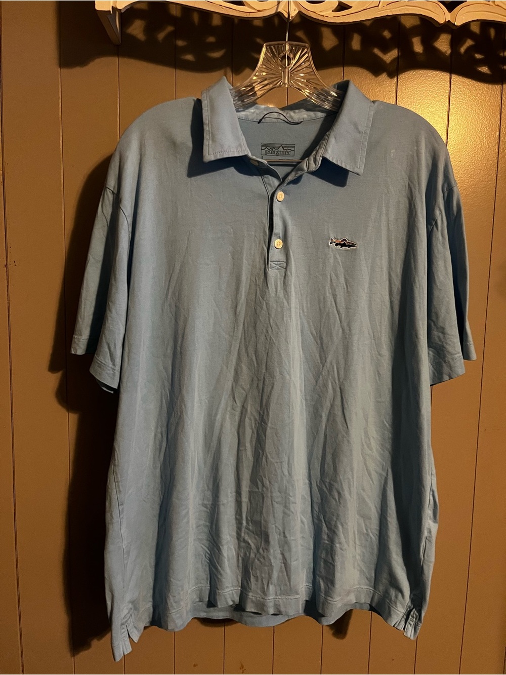 Patagonia men’s light blue polo shirt fish logo